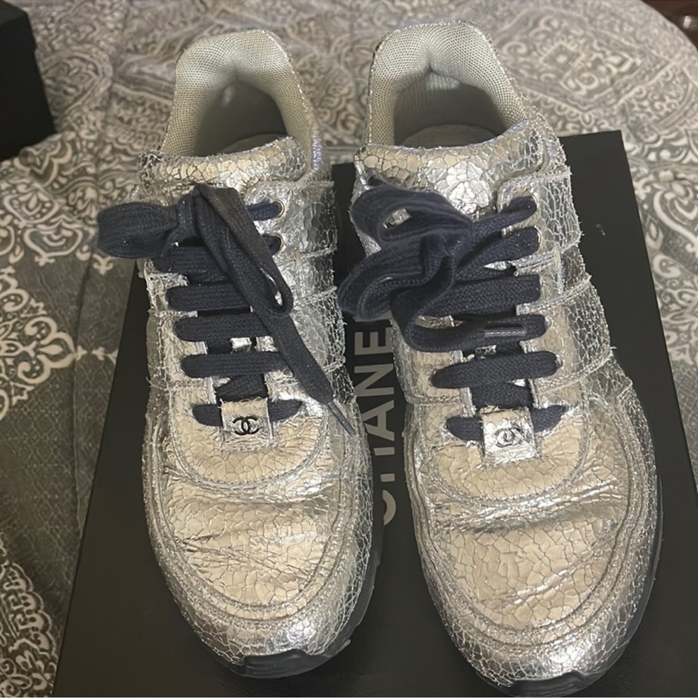 Chanel silver metallic sneakers.